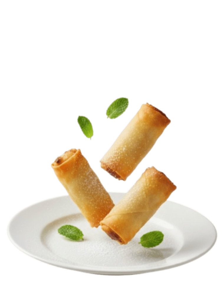 tres rollitos de primavera cayendo sobre un plato blanco junto a hojas verdes